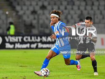 Takuto Oshima and Ovidiu Alexandru Bic are in action during the match between Universitatea Cluj and Universitatea Craiova at Cluj Arena Sta...