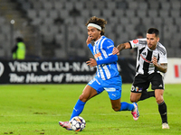 Takuto Oshima and Ovidiu Alexandru Bic are in action during the match between Universitatea Cluj and Universitatea Craiova at Cluj Arena Sta...