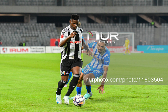 Mamadou Thiam and Stefan Baiaram are in action during the match between Universitatea Cluj and Universitatea Craiova at Cluj Arena Stadium i...