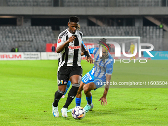 Mamadou Thiam and Stefan Baiaram are in action during the match between Universitatea Cluj and Universitatea Craiova at Cluj Arena Stadium i...