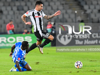 Ovidiu Alexandru Bic and Basilio Ndong Owono Nchama are in action during the match between Universitatea Cluj and Universitatea Craiova at C...