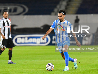 Stefan Baiaram is in action during the match between Universitatea Cluj and Universitatea Craiova at Cluj Arena Stadium in Cluj, Romania, on...