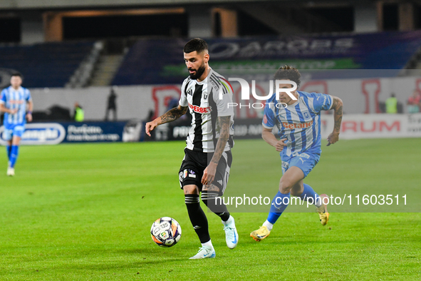 Radu Stefanita Boboc and Luis Javier Paradela Diaz are in action during the match between Universitatea Cluj and Universitatea Craiova at Cl...