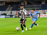 Radu Stefanita Boboc and Luis Javier Paradela Diaz are in action during the match between Universitatea Cluj and Universitatea Craiova at Cl...