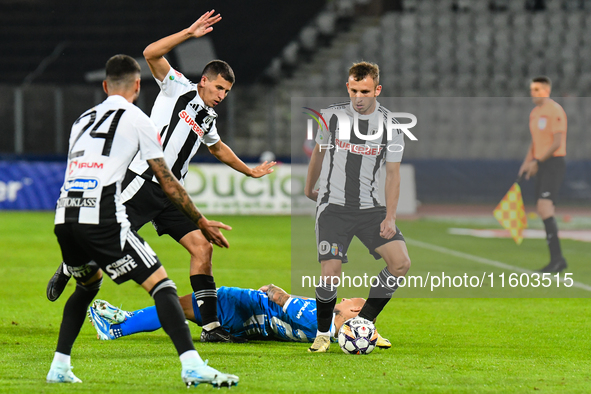 Robert Mihai Silaghi and Lucas Gabriel Masoero are in action during the match between Universitatea Cluj and Universitatea Craiova at Cluj A...