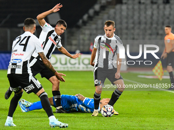 Robert Mihai Silaghi and Lucas Gabriel Masoero are in action during the match between Universitatea Cluj and Universitatea Craiova at Cluj A...