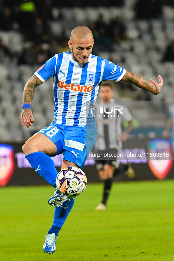 Ionut Alexandru Mitrita is in action during the match between Universitatea Cluj and Universitatea Craiova at Cluj Arena Stadium in Cluj, Ro...