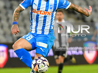 Ionut Alexandru Mitrita is in action during the match between Universitatea Cluj and Universitatea Craiova at Cluj Arena Stadium in Cluj, Ro...