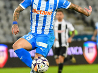 Ionut Alexandru Mitrita is in action during the match between Universitatea Cluj and Universitatea Craiova at Cluj Arena Stadium in Cluj, Ro...