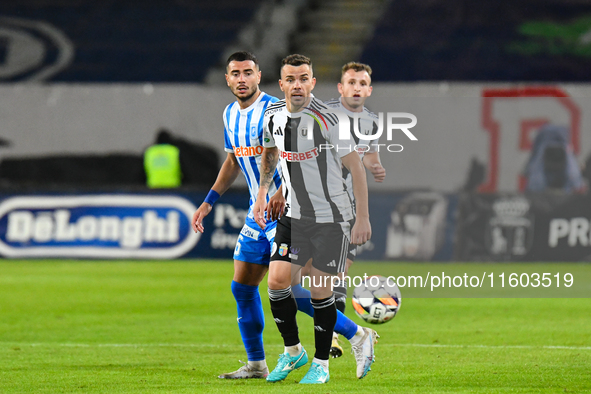 Dan Nicolae Nistor and Vladimir Ionut Screciu are in action during the match between Universitatea Cluj and Universitatea Craiova at Cluj Ar...