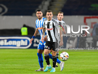 Dan Nicolae Nistor and Vladimir Ionut Screciu are in action during the match between Universitatea Cluj and Universitatea Craiova at Cluj Ar...