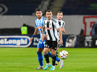 Dan Nicolae Nistor and Vladimir Ionut Screciu are in action during the match between Universitatea Cluj and Universitatea Craiova at Cluj Ar...