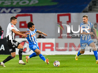 Luis Javier Paradela Diaz and Lucian Iulian Cristea are in action during the match between Universitatea Cluj and Universitatea Craiova at C...