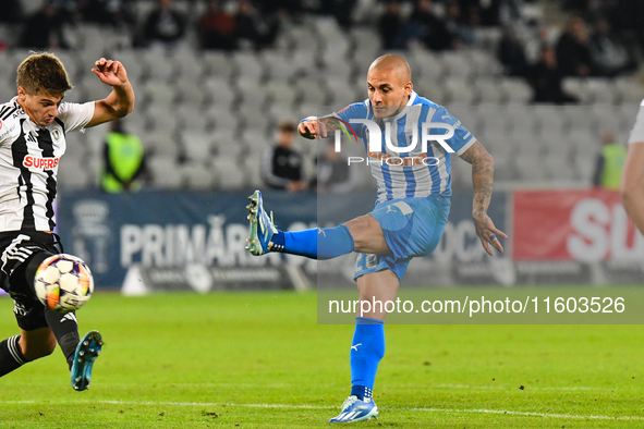 Ionut Alexandru Mitrita and Gabriel Bogdan Simion are in action during the match between Universitatea Cluj and Universitatea Craiova at Clu...