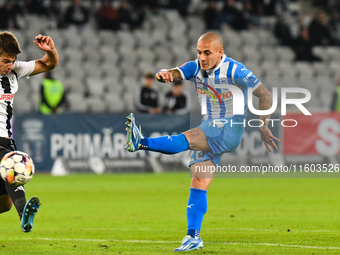 Ionut Alexandru Mitrita and Gabriel Bogdan Simion are in action during the match between Universitatea Cluj and Universitatea Craiova at Clu...