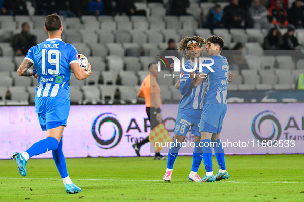 Takuto Oshima and Stefan Daniel Bana are in action during the match between Universitatea Cluj and Universitatea Craiova at Cluj Arena Stadi...