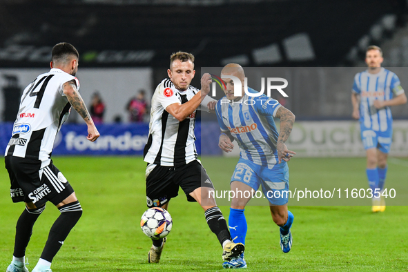 Ionut Alexandru Mitrita and Robert Mihai Silaghi are in action during the match between Universitatea Cluj and Universitatea Craiova at Cluj...