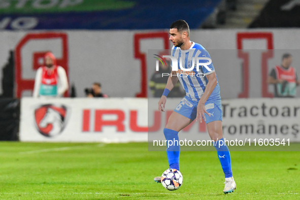 Vladimir Ionut SCRECIU is in action during the match between Universitatea Cluj and Universitatea Craiova at Cluj Arena Stadium in Cluj, Rom...