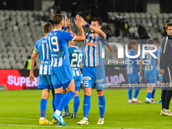 Nicusor Silviu Bancu, Juraj Badelj, and Elvir Koljic participate in the match between Universitatea Cluj and Universitatea Craiova in Cluj,...