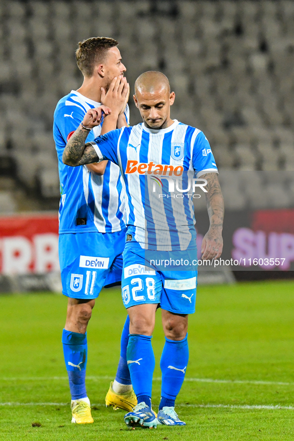 Nicusor Silviu Bancu and Ionut Alexandru Mitrita react during the match between Universitatea Cluj and Universitatea Craiova at Cluj Arena S...