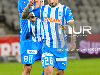 Nicusor Silviu Bancu and Ionut Alexandru Mitrita react during the match between Universitatea Cluj and Universitatea Craiova at Cluj Arena S...