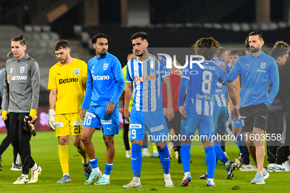 Silviu Lung, Iulian Laurentiu Popescu, Stefan Baiaram, Virgil Andrei Ivan, and Takuto Oshima participate in the match between Universitatea...