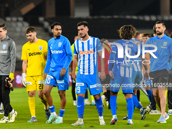 Silviu Lung, Iulian Laurentiu Popescu, Stefan Baiaram, Virgil Andrei Ivan, and Takuto Oshima participate in the match between Universitatea...