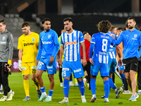 Silviu Lung, Iulian Laurentiu Popescu, Stefan Baiaram, Virgil Andrei Ivan, and Takuto Oshima participate in the match between Universitatea...