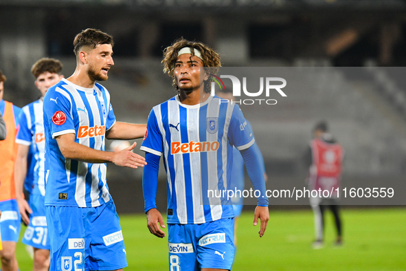 Cristian Mihai Capatina and Takuto Oshima participate in the match between Universitatea Cluj and Universitatea Craiova at Cluj Arena Stadiu...