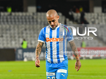 Ionut Alexandru Mitrita participates in the match between Universitatea Cluj and Universitatea Craiova at Cluj Arena Stadium in Cluj, Romani...