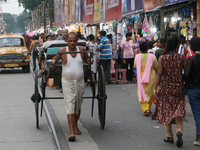 Hand-pulled rickshaw pullers in Kolkata, India, wait for customers on September 21, 2024. (