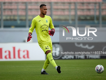 Henri Christoffer Mafoumbi, goalkeeper of Floriana, is in action during the Malta 360 Sports Premier League soccer match between Floriana an...