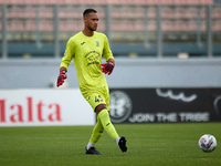 Henri Christoffer Mafoumbi, goalkeeper of Floriana, is in action during the Malta 360 Sports Premier League soccer match between Floriana an...