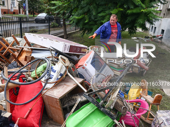 A man is cleaning a house which was damaged by water after Nysa Klodzka river flooded town of Lewin Brzeski in southwestern Poland. Septembe...