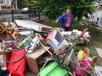 A man is cleaning a house which was damaged by water after Nysa Klodzka river flooded town of Lewin Brzeski in southwestern Poland. Septembe...