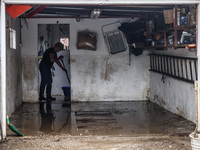 A woman is cleaning a facility which was damaged by water after Nysa Klodzka river flooded town of Lewin Brzeski in southwestern Poland. Sep...