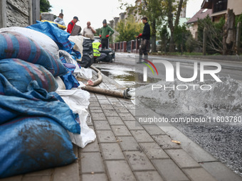 Water is being pump out of residential area after Nysa Klodzka river flooded town of Lewin Brzeski in southwestern Poland. September 23rd, 2...