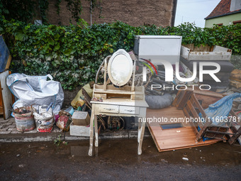 House items that were damaged by water are seen outside residential area after Nysa Klodzka river flooded town of Lewin Brzeski in southwest...