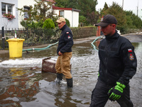 Firefighters are pumping out water from residential areas after Nysa Klodzka river flooded town of Lewin Brzeski in southwestern Poland. Sep...