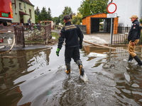 Firefighters are pumping out water from residential areas after Nysa Klodzka river flooded town of Lewin Brzeski in southwestern Poland. Sep...