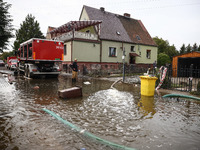 Firefighters are pumping out water from residential areas after Nysa Klodzka river flooded town of Lewin Brzeski in southwestern Poland. Sep...