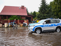 People are cleaning their houses which were damaged by water after Nysa Klodzka river flooded town of Lewin Brzeski in southwestern Poland....