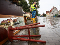 House items that were damaged by water are seen outside residential area after Nysa Klodzka river flooded town of Lewin Brzeski in southwest...