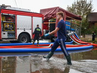 Firefighters are pumping out water from residential areas after Nysa Klodzka river flooded town of Lewin Brzeski in southwestern Poland. Sep...