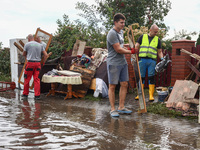 People are cleaning a house which was damaged by water after Nysa Klodzka river flooded town of Lewin Brzeski in southwestern Poland. Septem...