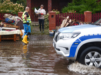 People are cleaning a house which was damaged by water after Nysa Klodzka river flooded town of Lewin Brzeski in southwestern Poland. Septem...