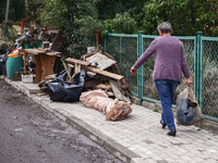 A man is cleaning a house which was damaged by water after Nysa Klodzka river flooded town of Lewin Brzeski in southwestern Poland. Septembe...