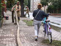 Firefighters are pumping out water from residential areas after Nysa Klodzka river flooded town of Lewin Brzeski in southwestern Poland. Sep...