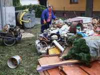 A man is cleaning a house which was damaged by water after Nysa Klodzka river flooded town of Lewin Brzeski in southwestern Poland. Septembe...