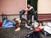 A man is cleaning a house which was damaged by water after Nysa Klodzka river flooded town of Lewin Brzeski in southwestern Poland. Septembe...